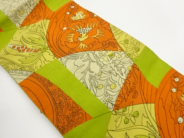 Nagoya obi woven in curved lines with floral and leaf patterns